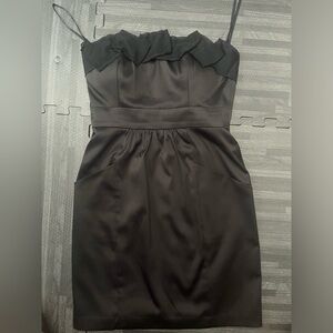 Black strapless, beautifully designed mini dress with pockets! Size 4.
